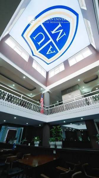 The AUM shield on the atrium ceiling inside the building