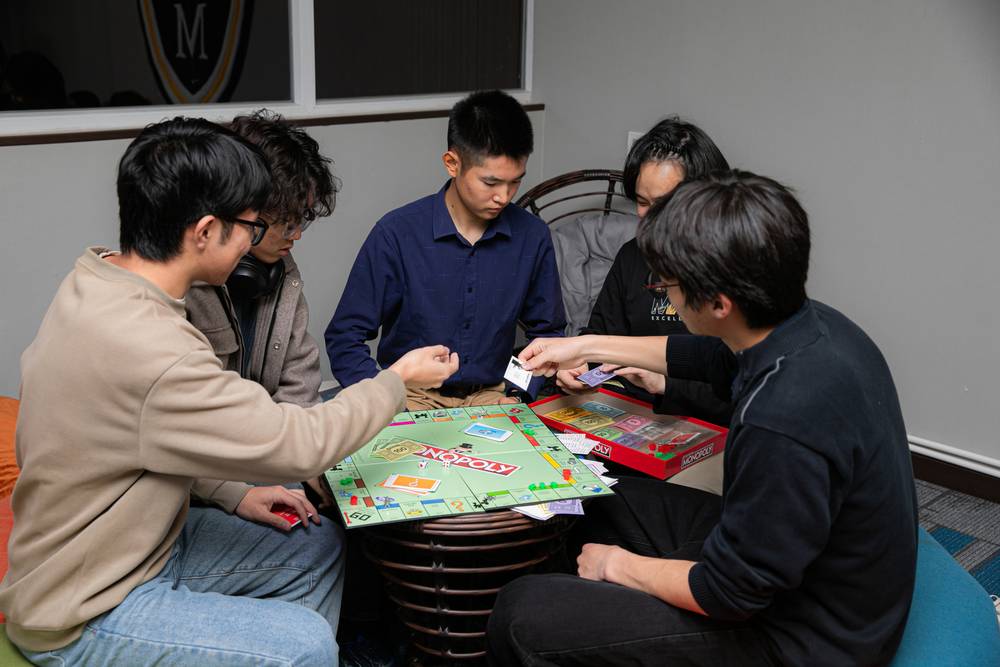 Students playing a board game together