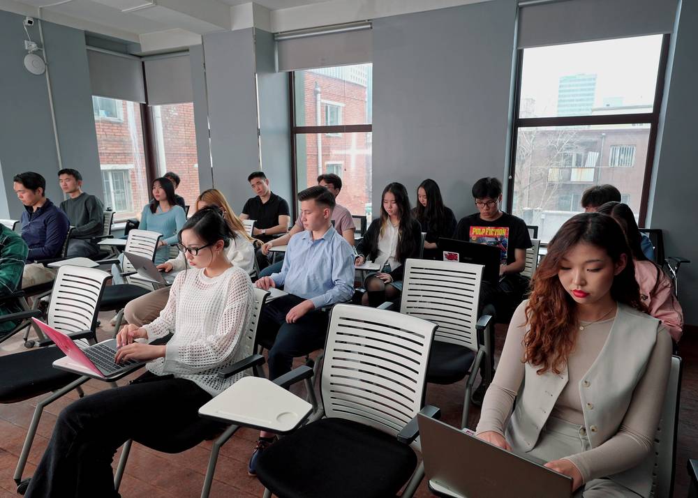 Students taking notes during class
